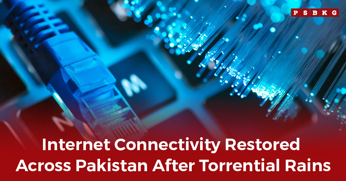 A close-up of a blue ethernet cable plugged into a keyboard with fiber optic lights, symbolizing restored internet connectivity in Pakistan.
