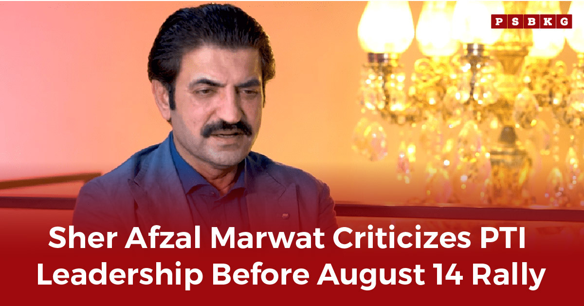 Sher Afzal Marwat addresses PTI leadership internal conflict, framed by warm lighting and an ornate chandelier in the background.