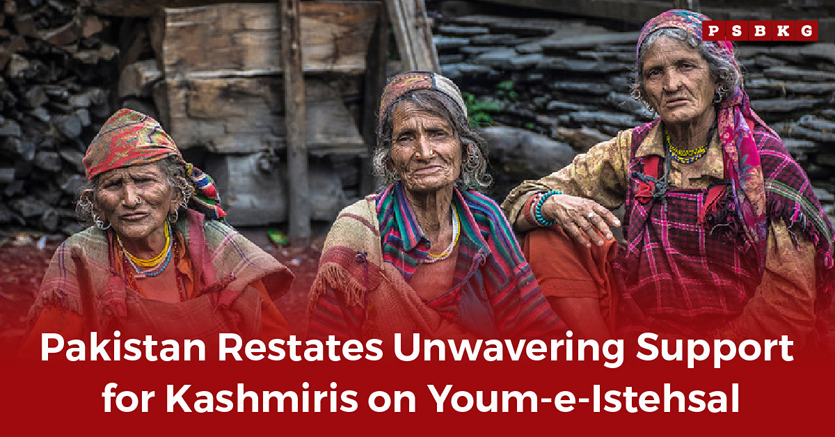 Three women in colorful traditional attire sit together in a rustic setting, symbolizing solidarity, cultural heritage, and Pakistan Army support for Kashmiris during Youm-e-Istehsal observances.