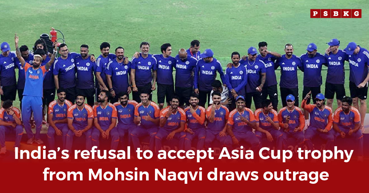Indian cricket team in blue and orange uniforms poses after a contentious Asia Cup event, highlighting India trophy refusal.