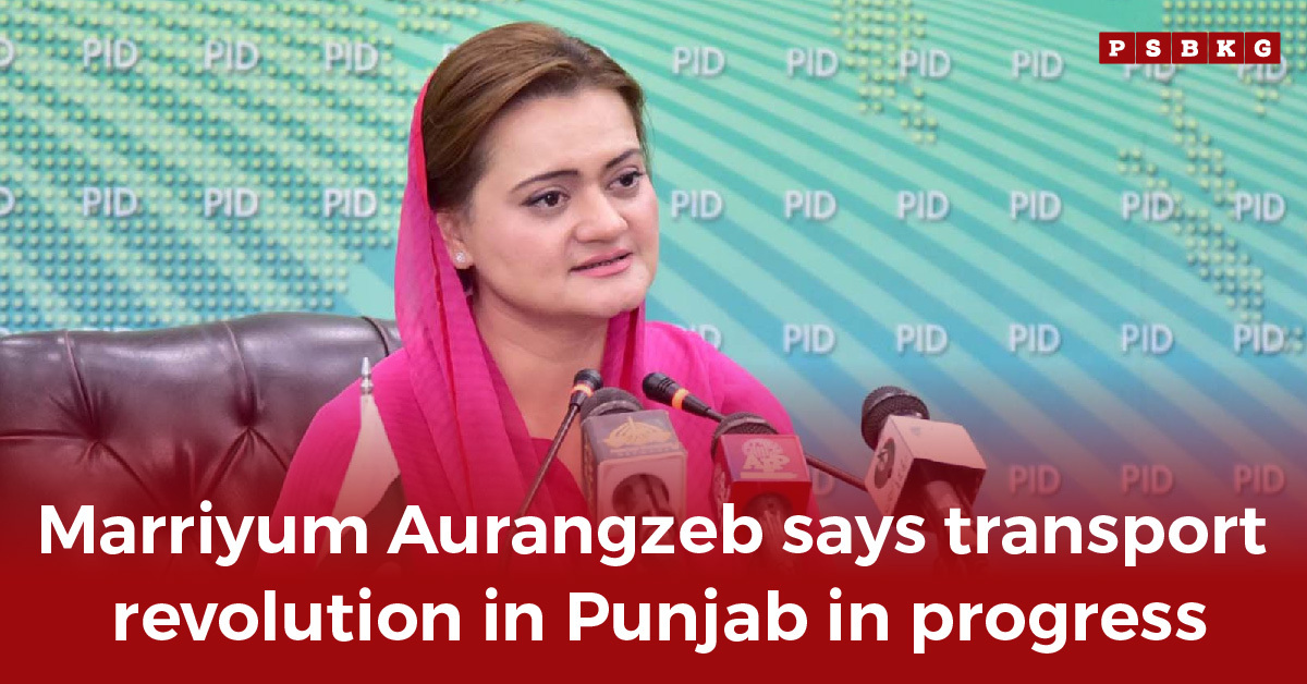 A woman in a pink shawl speaks at a press conference with microphones, announcing Punjab transport revolution.