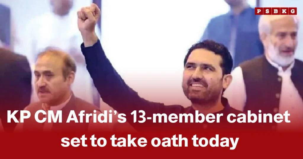A group of individuals gathered at an oath-taking ceremony, with one person raising a fist in celebration, marking KP CM Afridi’s new 13-member cabinet taking oath KP cabinet oath.