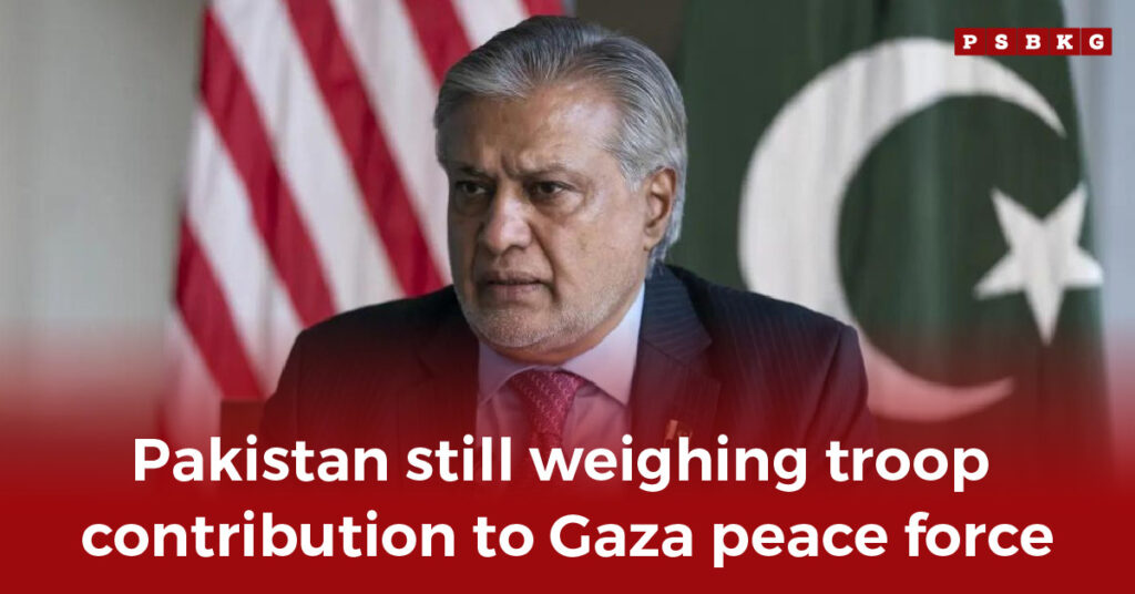 A blurred figure sits before Pakistani and American flags, discussing troop contributions to a Pakistan Gaza peace force.