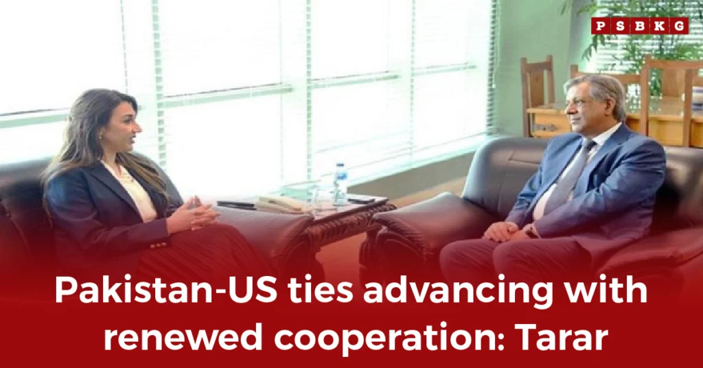 Two officials meet in a professional setting to discuss advancement of Pakistan US relationship.