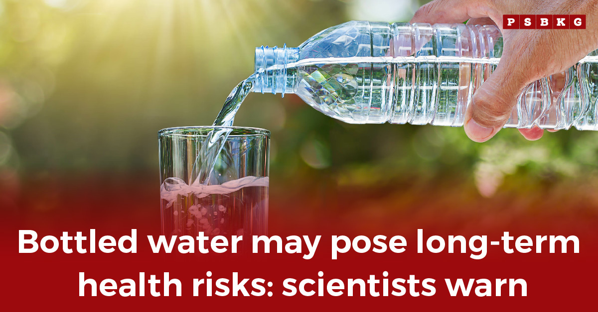 A person pouring water from a plastic bottle into a glass with sunlight in the background, illustrating concerns about the health risks of bottled water.