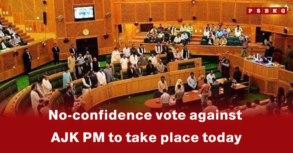 Inside a legislative assembly, members are seated and standing, with the text "AJK no-confidence vote against the PM to take place today" overlayed in red.