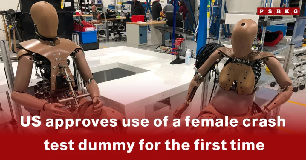 Two female crash test dummies sit side by side in a laboratory, demonstrating their use in vehicle safety testing following recent US approval for enhanced gender-inclusive crash simulations.