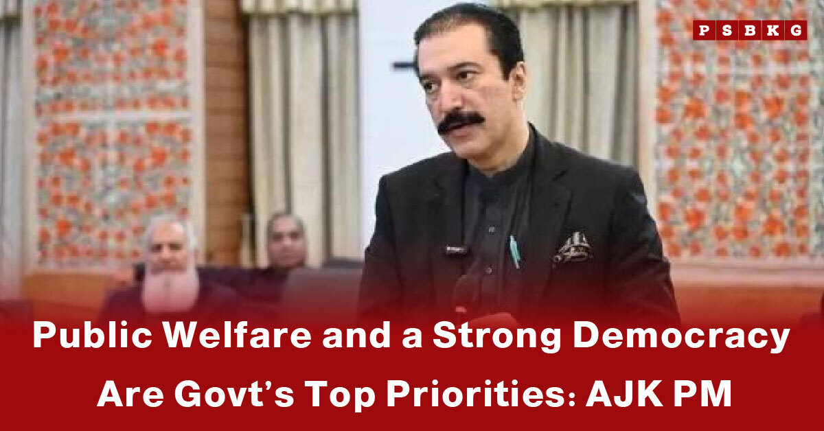 AJK Prime Minister speaks in a formal setting about the AJK government priorities focused on public welfare and strengthening democracy.