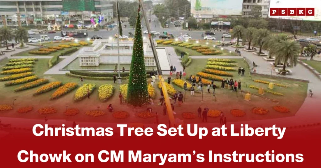 A festive Christmas tree stands tall at Liberty Chowk, surrounded by colorful flower arrangements and onlookers, highlighting Christmas tree Liberty Chowk celebrations.