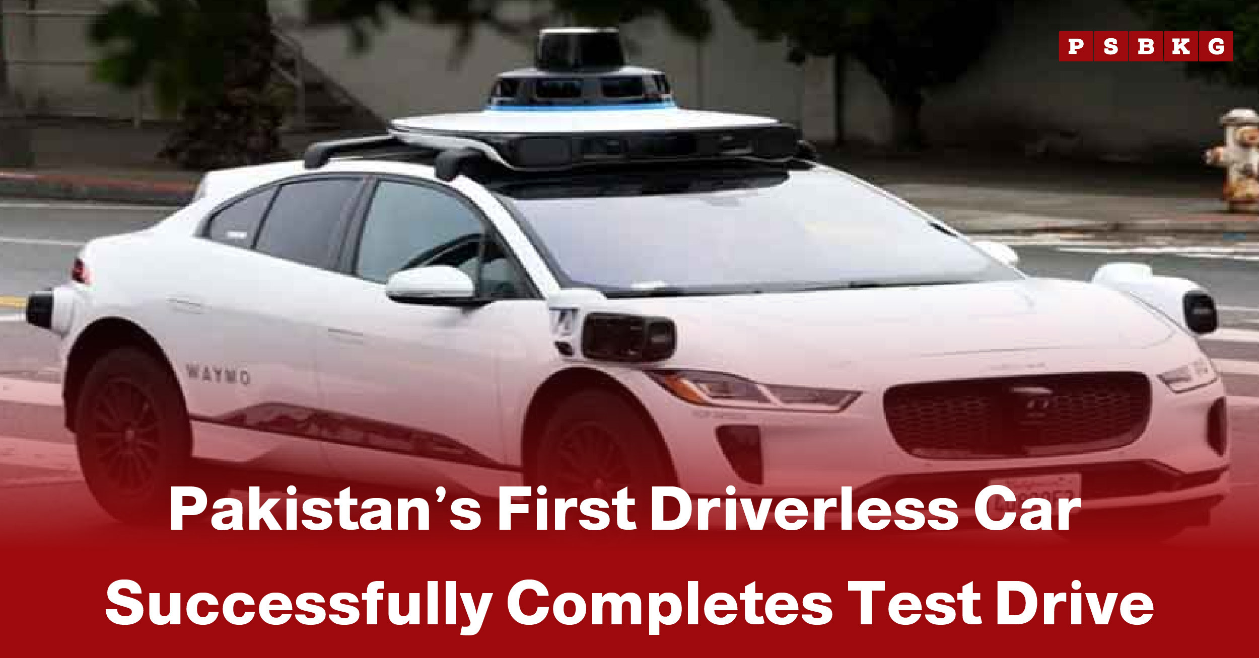 A white driverless car equipped with sensors completes its test drive on a city street, showcasing Pakistan driverless car test.