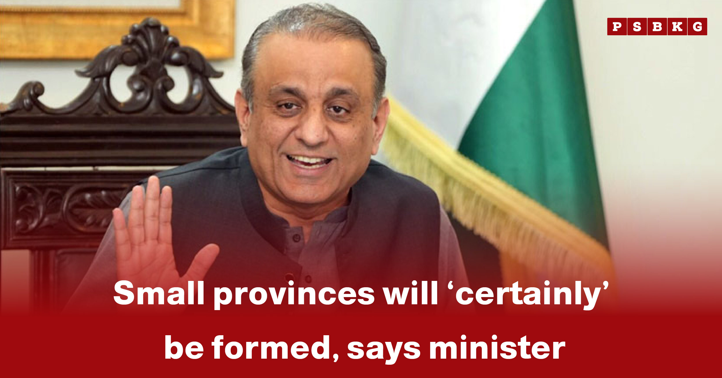 A government minister in a formal setting discusses the formation of small provinces Pakistan while gesturing with one hand.