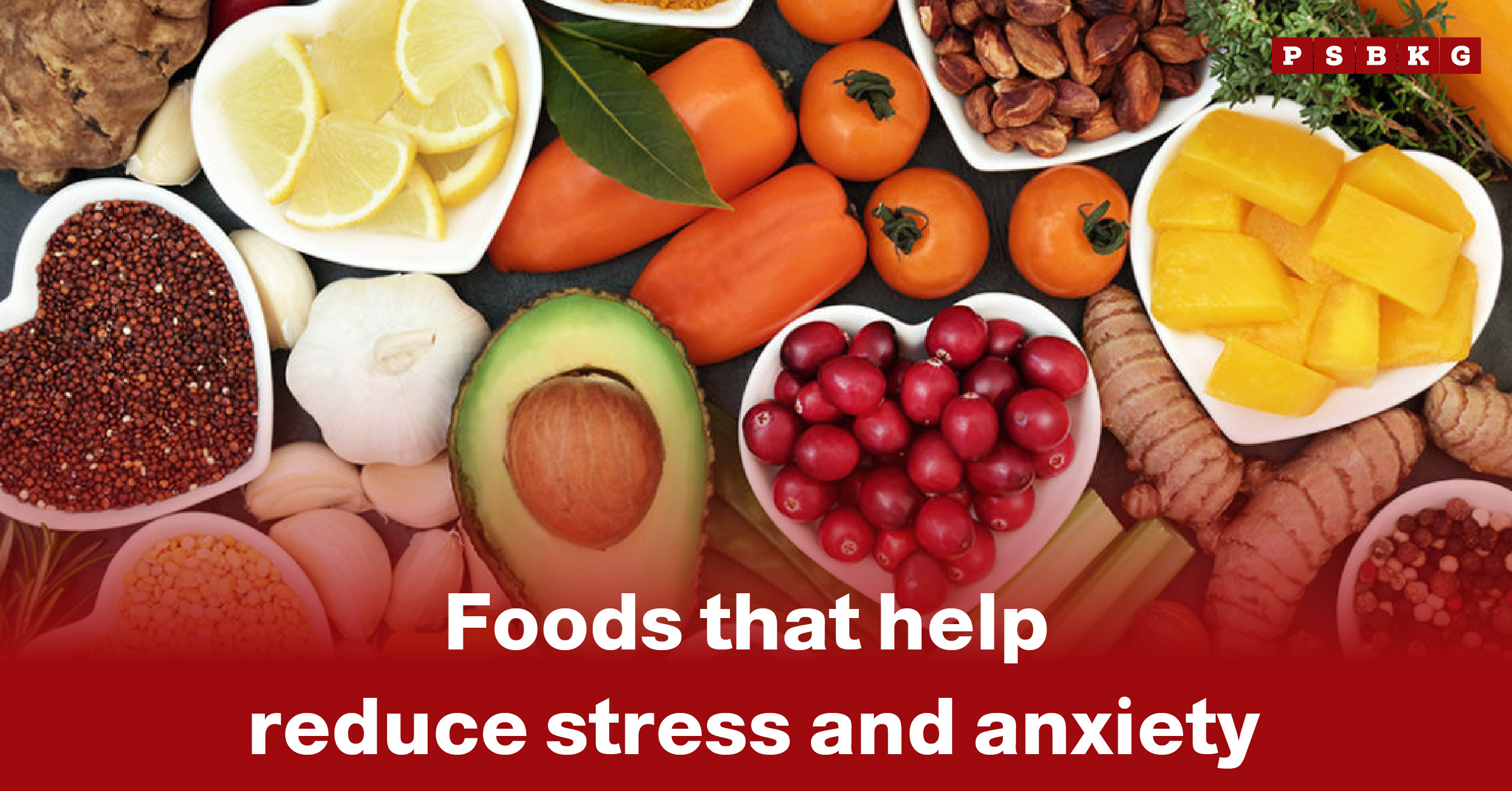 A vibrant assortment of fruits, vegetables, and grains arranged in heart-shaped bowls, highlighting foods to reduce stress and anxiety.