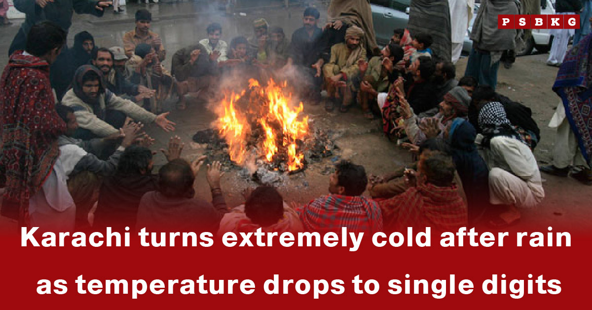 A group of people huddles around a fire for warmth in Karachi as temperatures drop to single digits after rain, highlighting Karachi cold weather after rain.