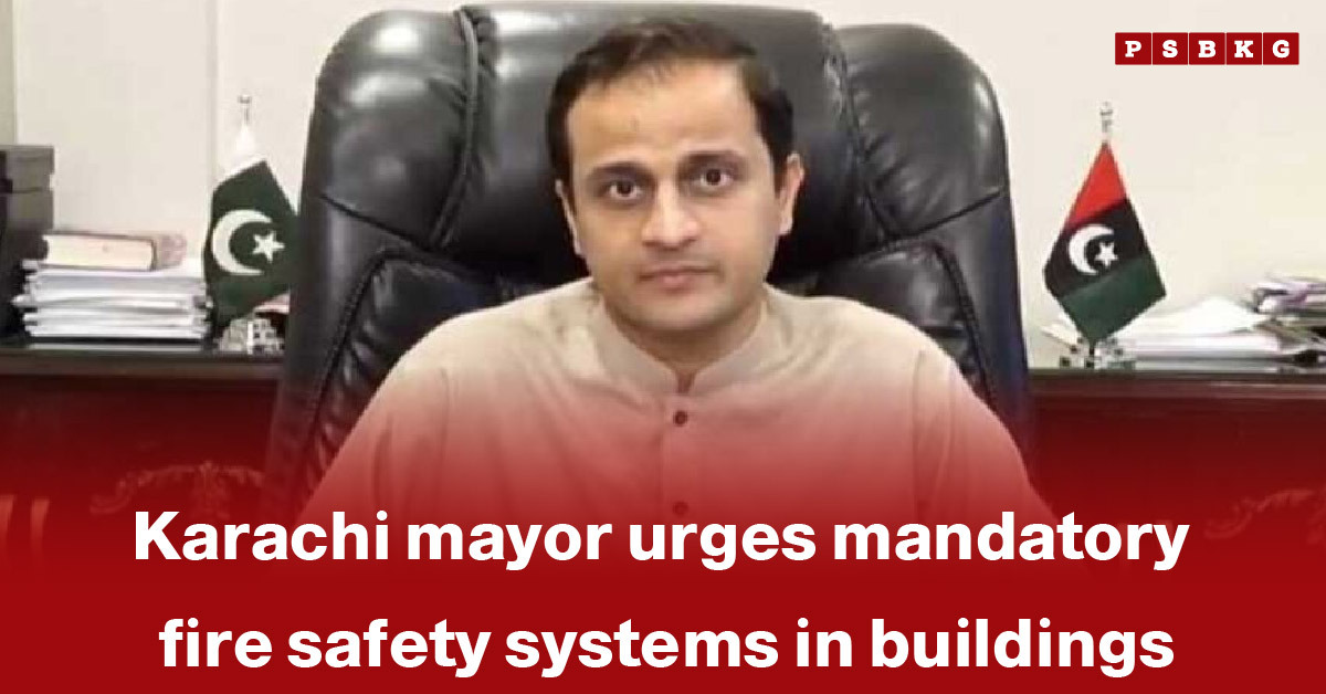 Karachi mayor emphasizes the need for mandatory fire safety systems in buildings during an official meeting, highlighting Karachi fire safety systems.