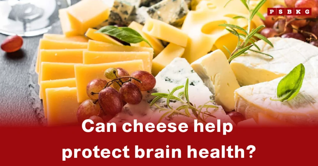 An assortment of cheeses garnished with herbs and grapes, with a glass of wine in the background, highlighting cheese brain health benefits.