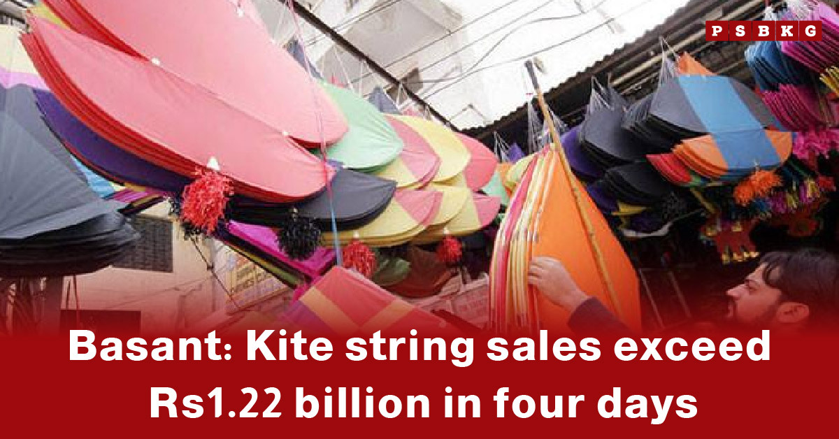 Colorful kites hang in a marketplace, highlighting Basant kite string sales and festive spirit, with sales surpassing Rs1.22 billion in four days.