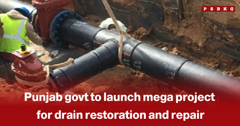 Punjab drain restoration project: Workers install large black drainage pipes in a trench as part of a Punjab government initiative for drain restoration and repair.