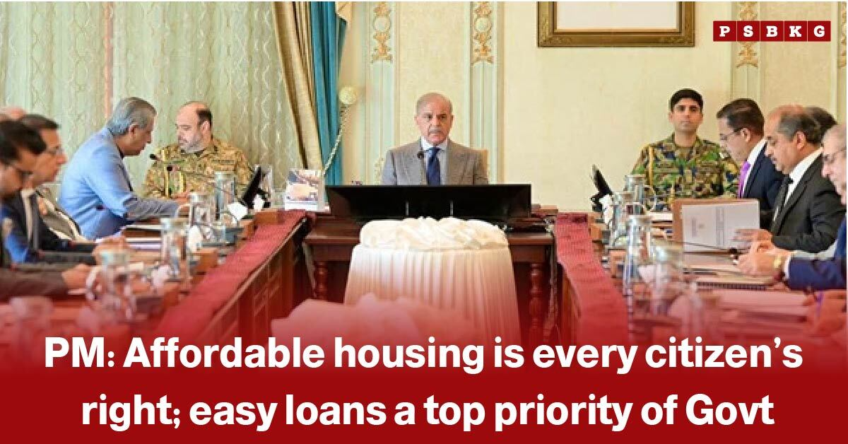 Government officials and military personnel seated around a conference table, discussing Affordable Housing Pakistan policy and initiatives to provide housing for citizens.