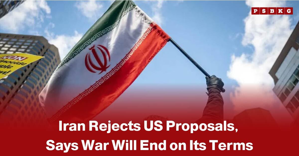 Person holding an Iranian flag against a blue sky and buildings, with text about Iran rejects US proposal and insisting the war will end only on its terms, highlighting Iran rejects US proposal.