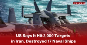 US hits 2000 targets in Iran: U.S. military jets on an aircraft carrier with ocean in the background, accompanied by crew members, highlighting extensive strikes against nearly 2,000 targets in Iran during the ongoing conflict.