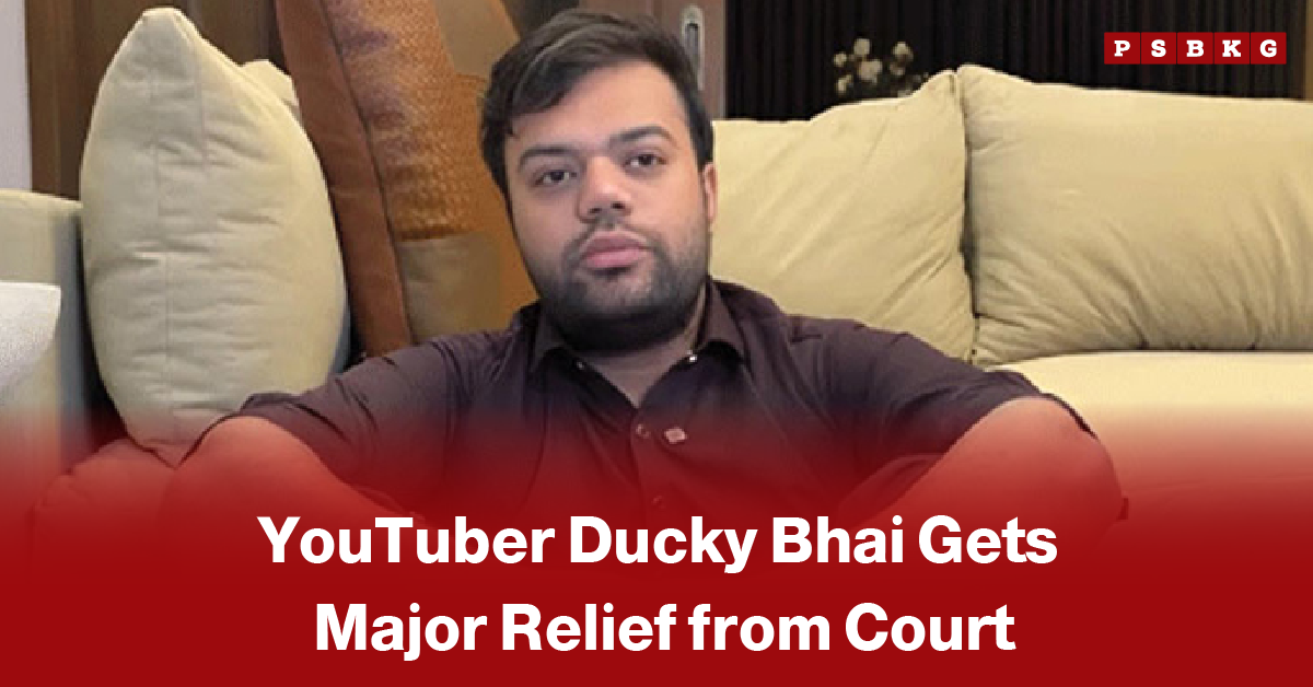 Ducky Bhai court relief case blurred image of a man sitting on a beige sofa with text overlay stating YouTuber Ducky Bhai gets major relief from court.