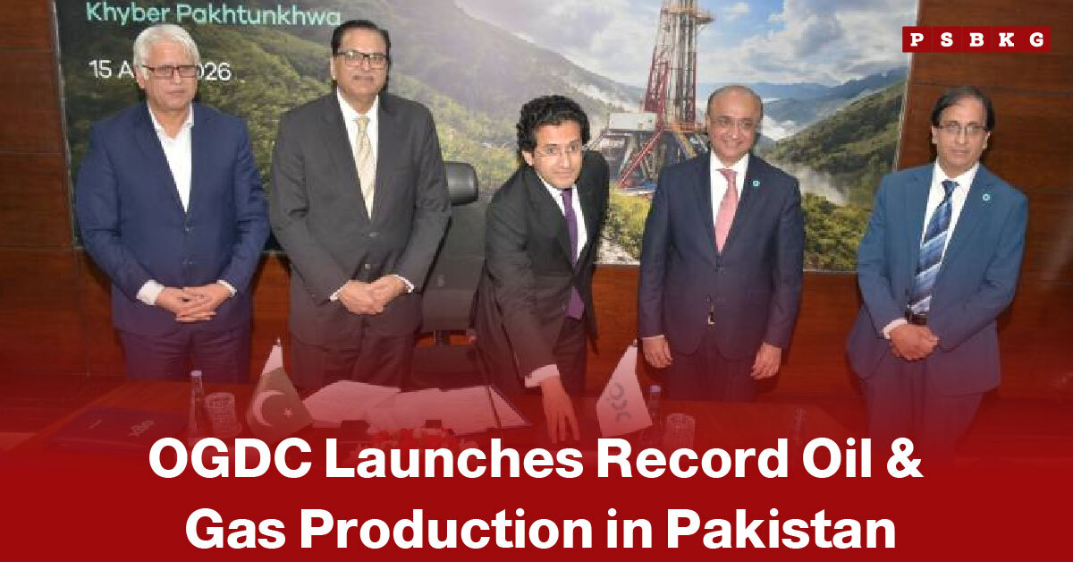 OGDC oil and gas production Pakistan five men in suits pose at a signing event with a backdrop of oil rigs and mountains, celebrating OGDC’s record oil and gas production launch.