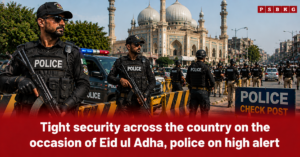 Image of police officers standing on high alert at a security checkpoint near a mosque in an urban area, with increased deployment for Eid ul Adha to ensure safety and crowd control during prayers and gatherings.
