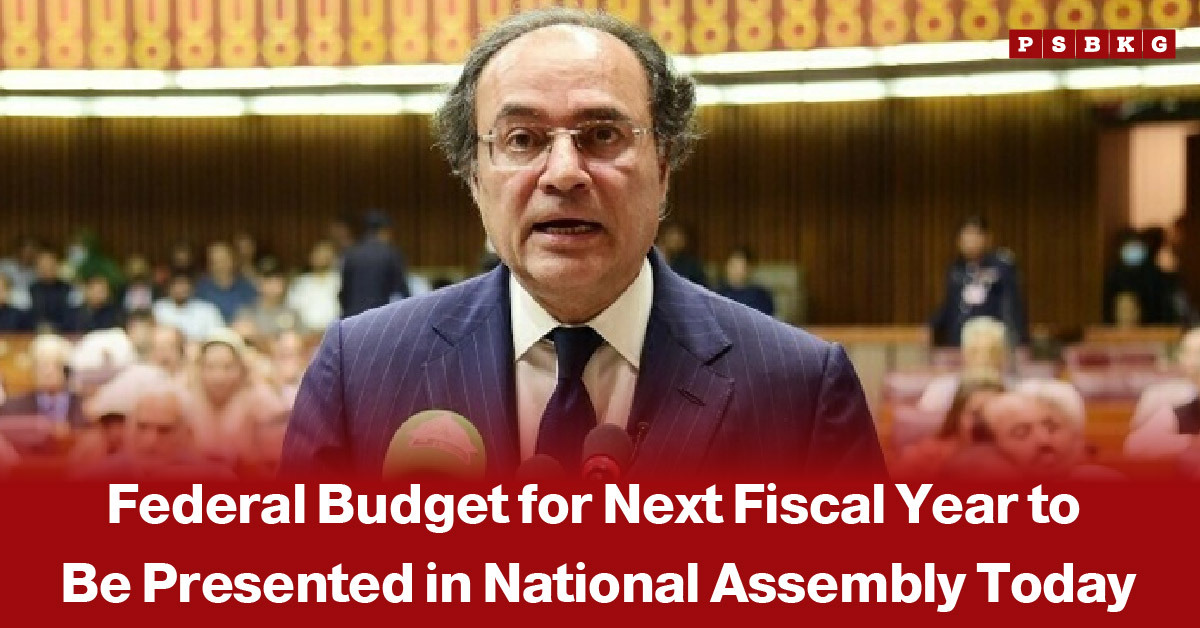 Image of a speaker standing at a podium inside Pakistan’s National Assembly hall, with a formal setting and seated lawmakers in the background, accompanied by a news-style headline about the federal budget for fiscal year 2026 being presented today.
