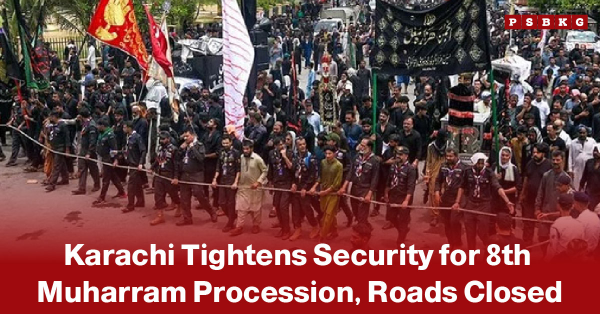 Large security deployment in Karachi with police personnel and barriers positioned along procession routes, as participants carrying black flags and banners gather for the central 8th Muharram procession under heightened security measures and road closures.