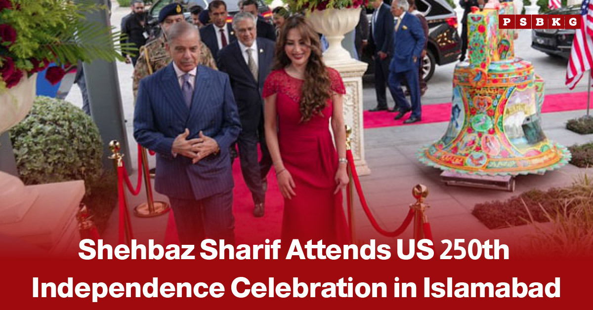 Image of Pakistan’s Prime Minister Shehbaz Sharif walking alongside a woman on a red carpet during a formal ceremony celebrating the 250th anniversary of U.S. independence in Islamabad, with dignitaries and event decorations visible in the background.