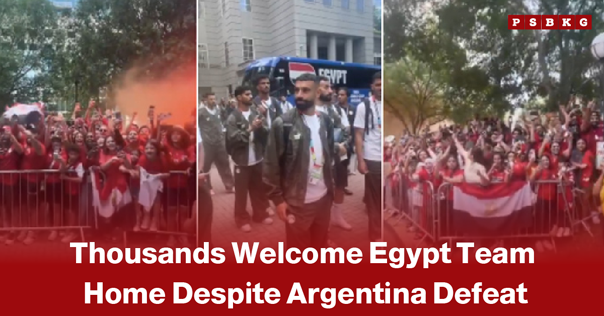 Crowd of cheering Egyptian fans waving national flags as they warmly welcome their national football team after returning home, with the team bus visible in the background, illustrating a heartfelt reception despite the team's defeat to Argentina.
